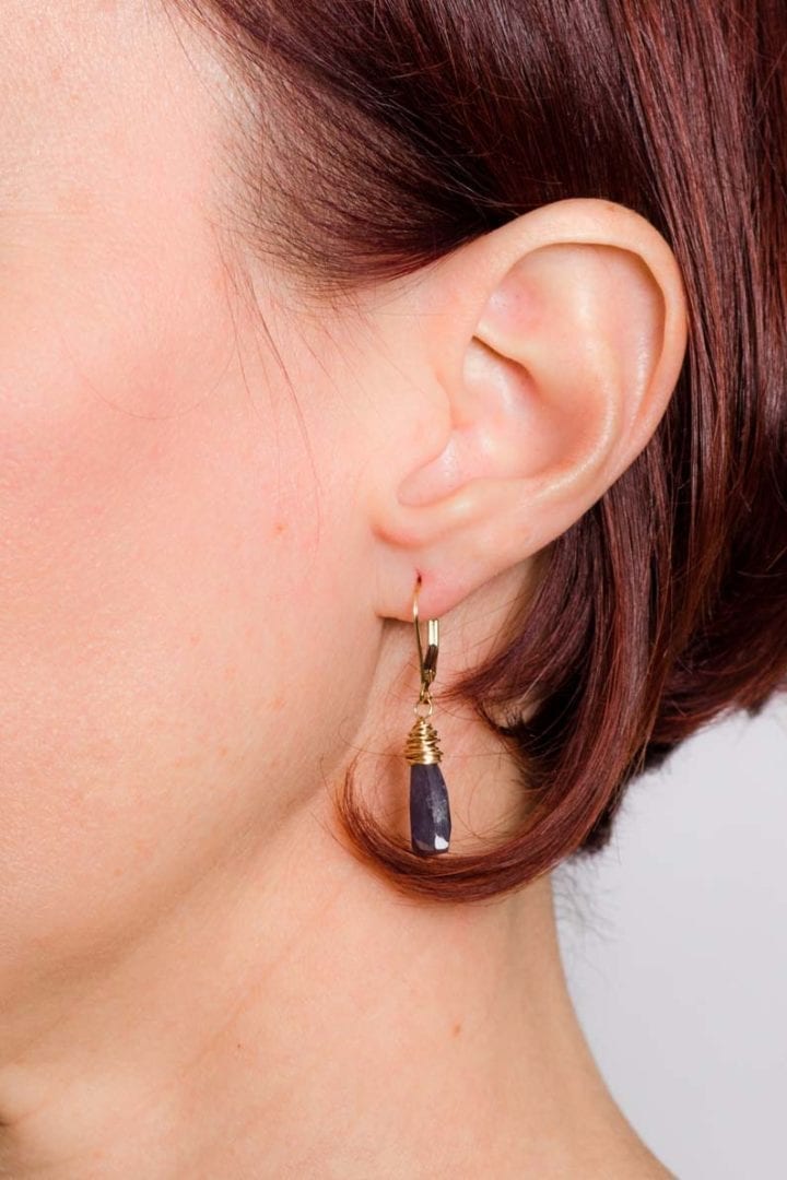 iolite triangle drop earrings on model
