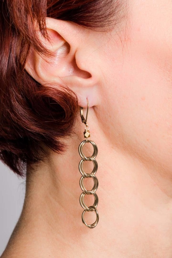 antique large linear earrings on model