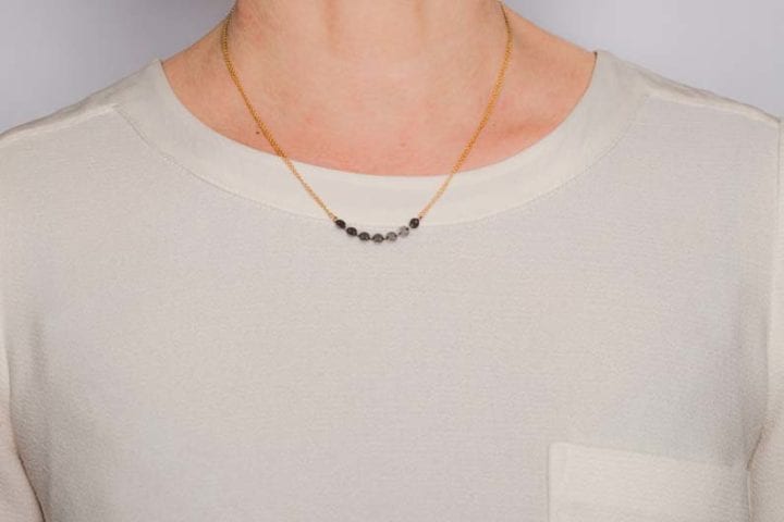 delicate disc necklace on model