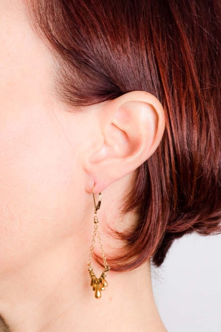 teardrop swing earrings on model 2